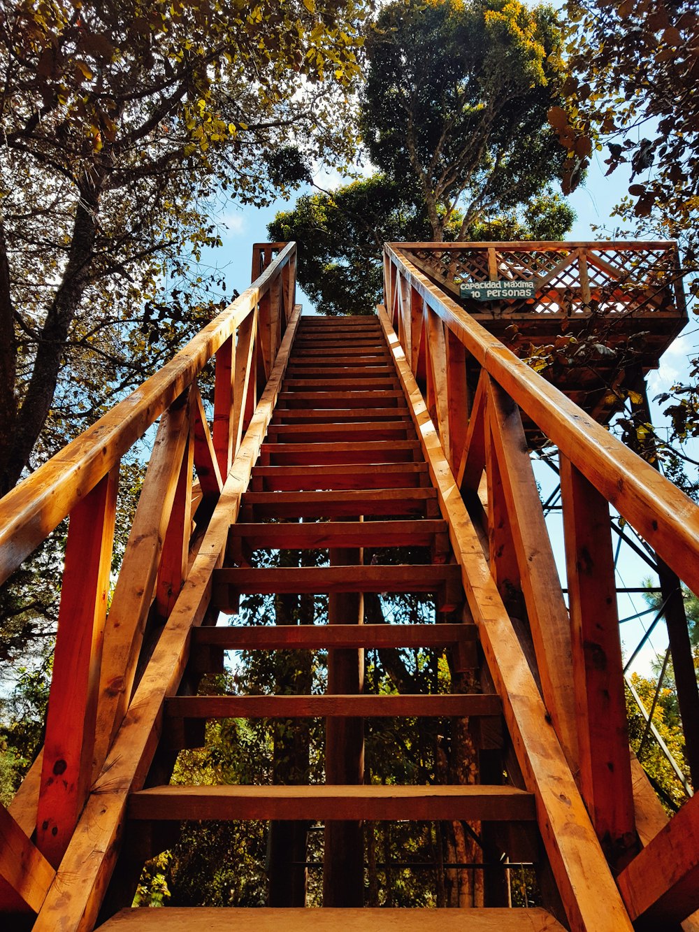 a wooden staircase going up into the sky