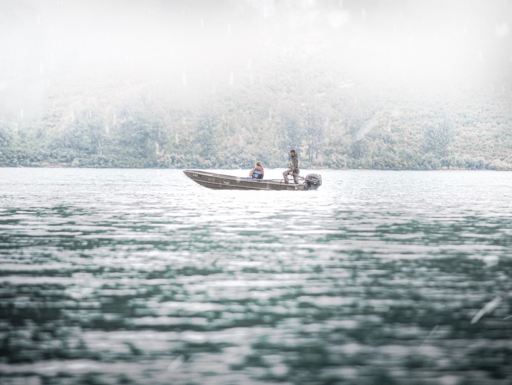 two person riding on boat