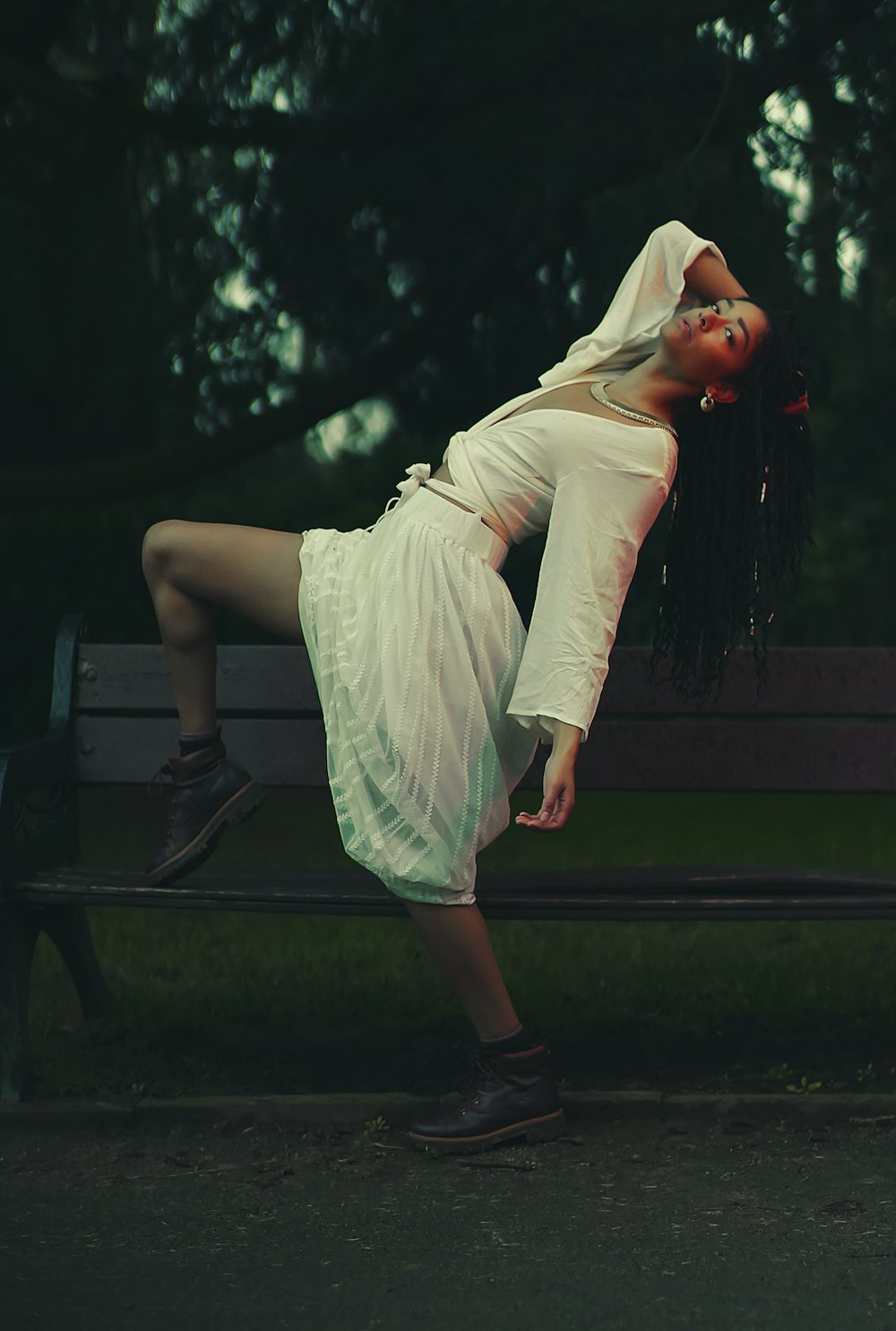 woman doing post on bench during daytime