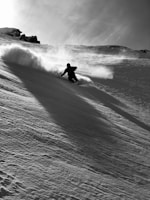 A dynamic shot of a ski instructor guiding a group down a snowy trail.