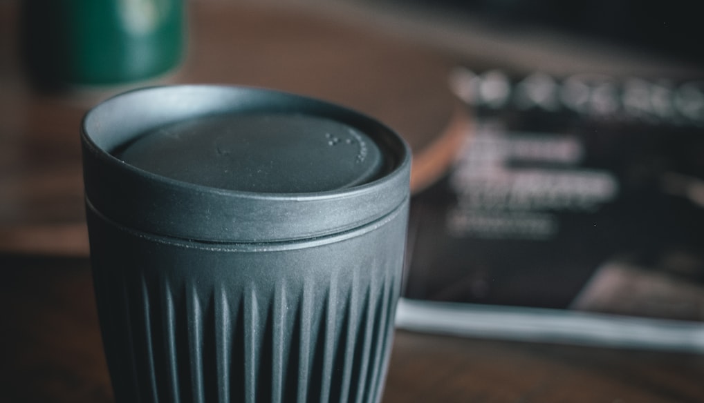 cup with lid on table