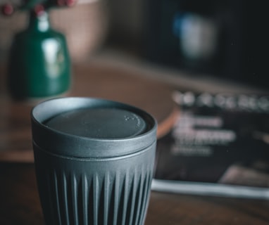 cup with lid on table