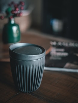 cup with lid on table
