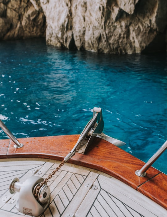 white and brown boat in Capri Italy