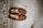 A pair of stylish loafers placed on a wooden floor.