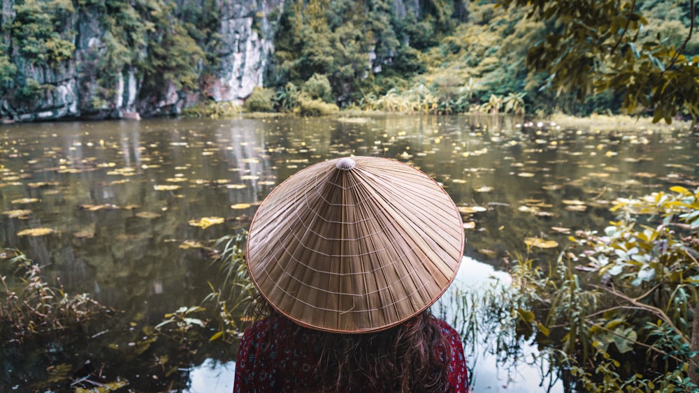 woman wearing brown wicker hat