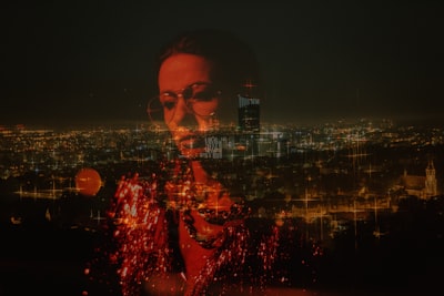 woman reflection on glass overlooking city at night visionary zoom background