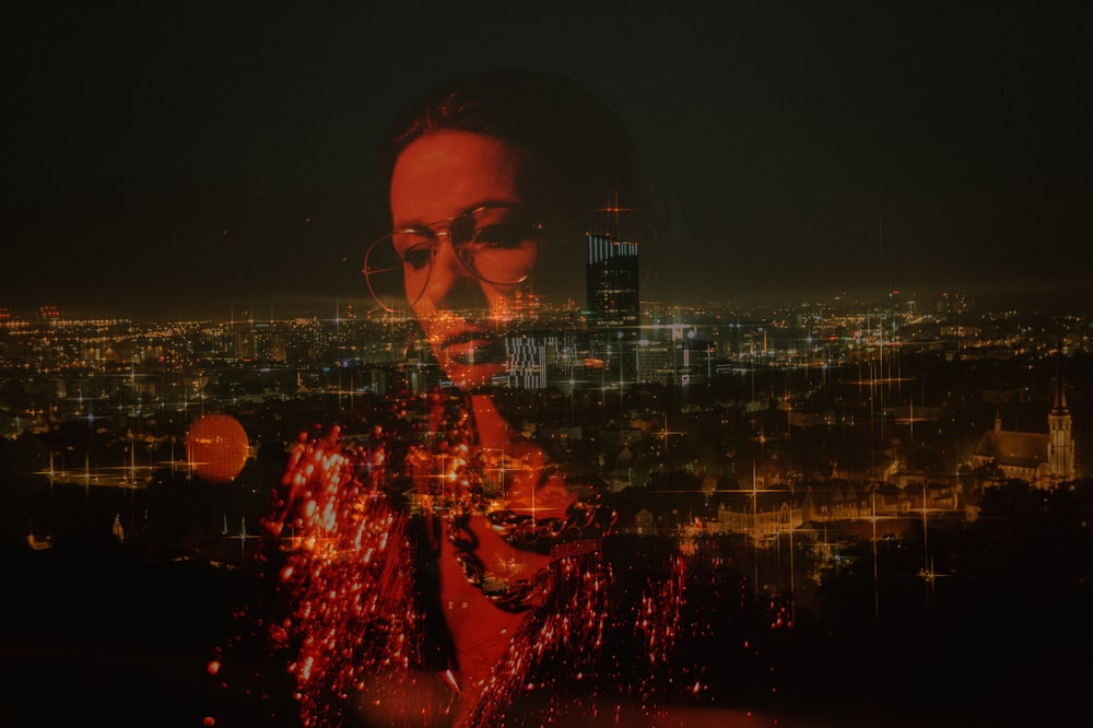 woman reflection on glass overlooking city at night