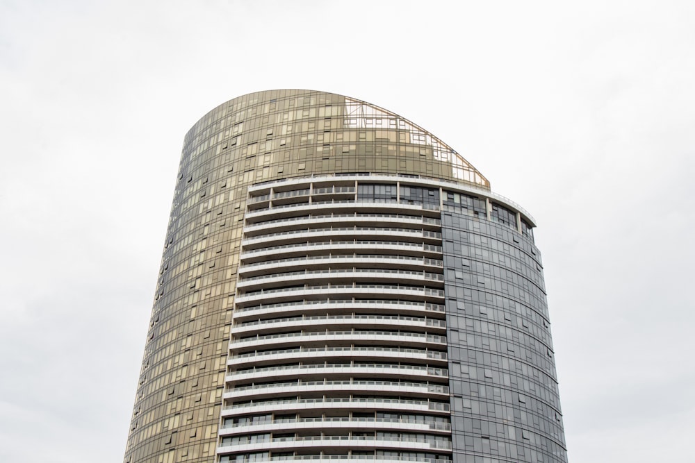 curtain wall high-rise building during daytime