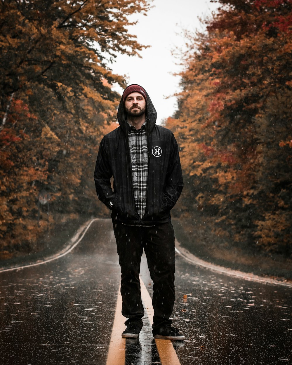 man standing in the middle of the road