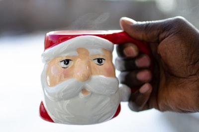 white and red santa claus ceramic mug father christmas teams background