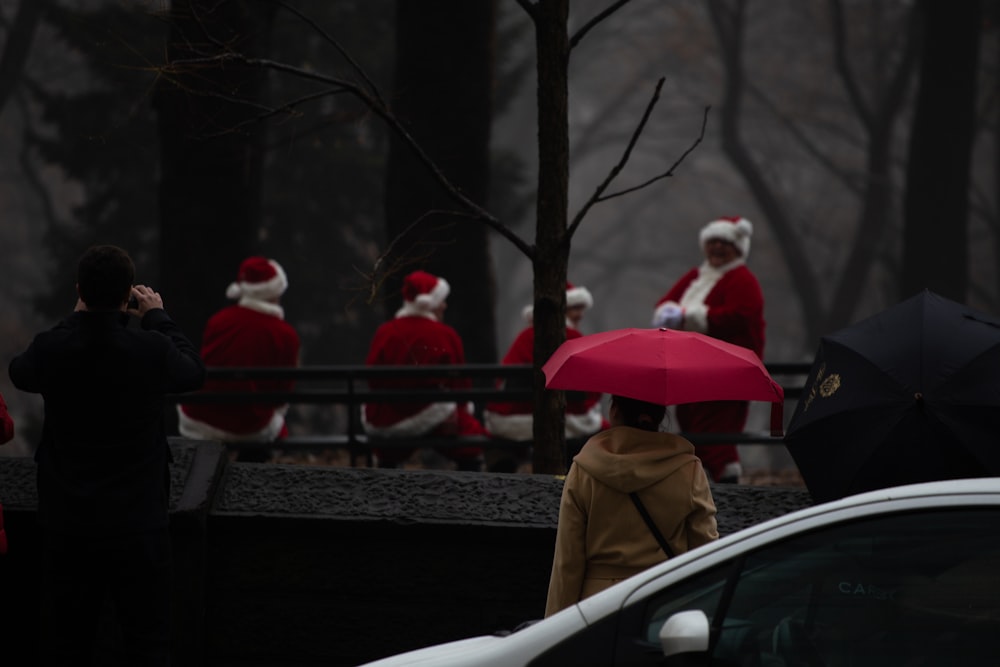 shallow focus photo of people in Christmas-themed suit