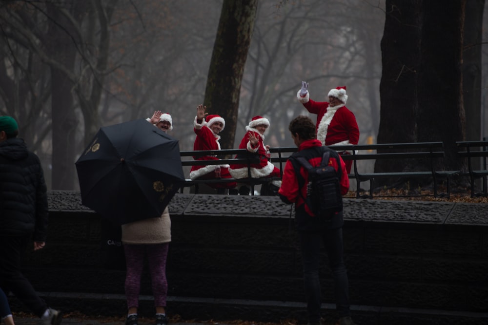shallow focus photo of people wearing Christmas suit