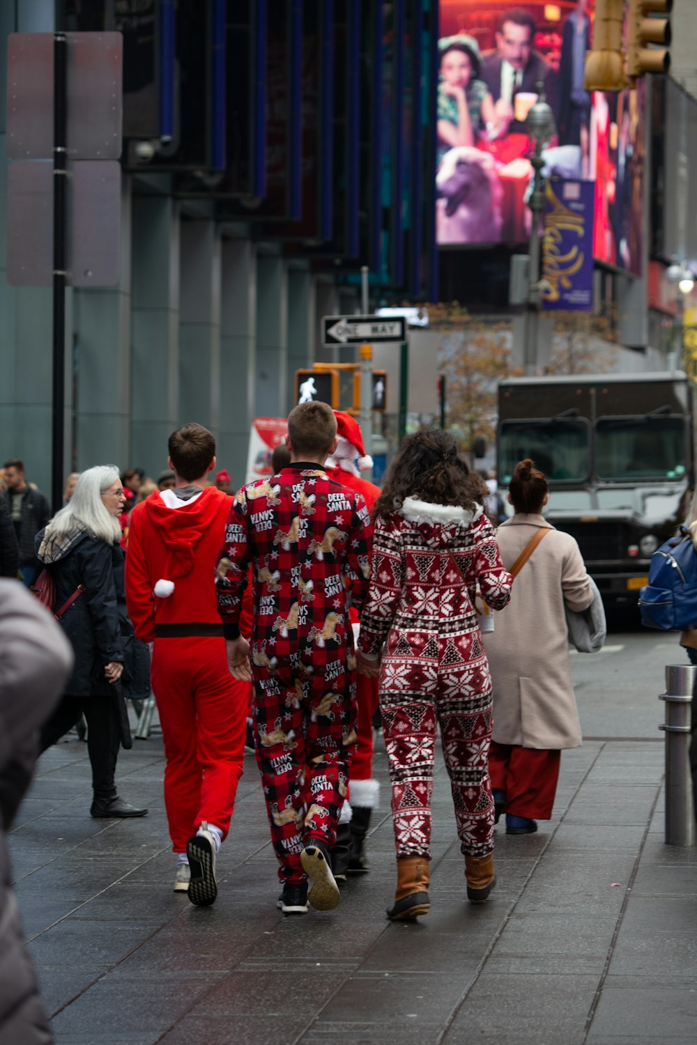 people wearing multicolored footies walking on street