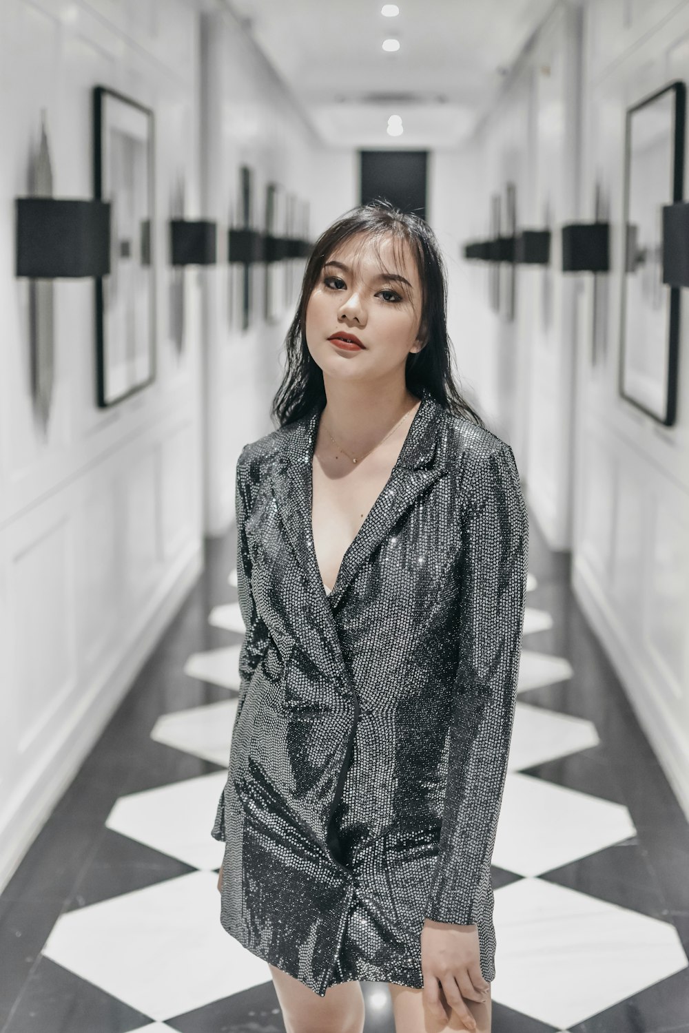 woman wearing gray long-sleeved mini dress standing