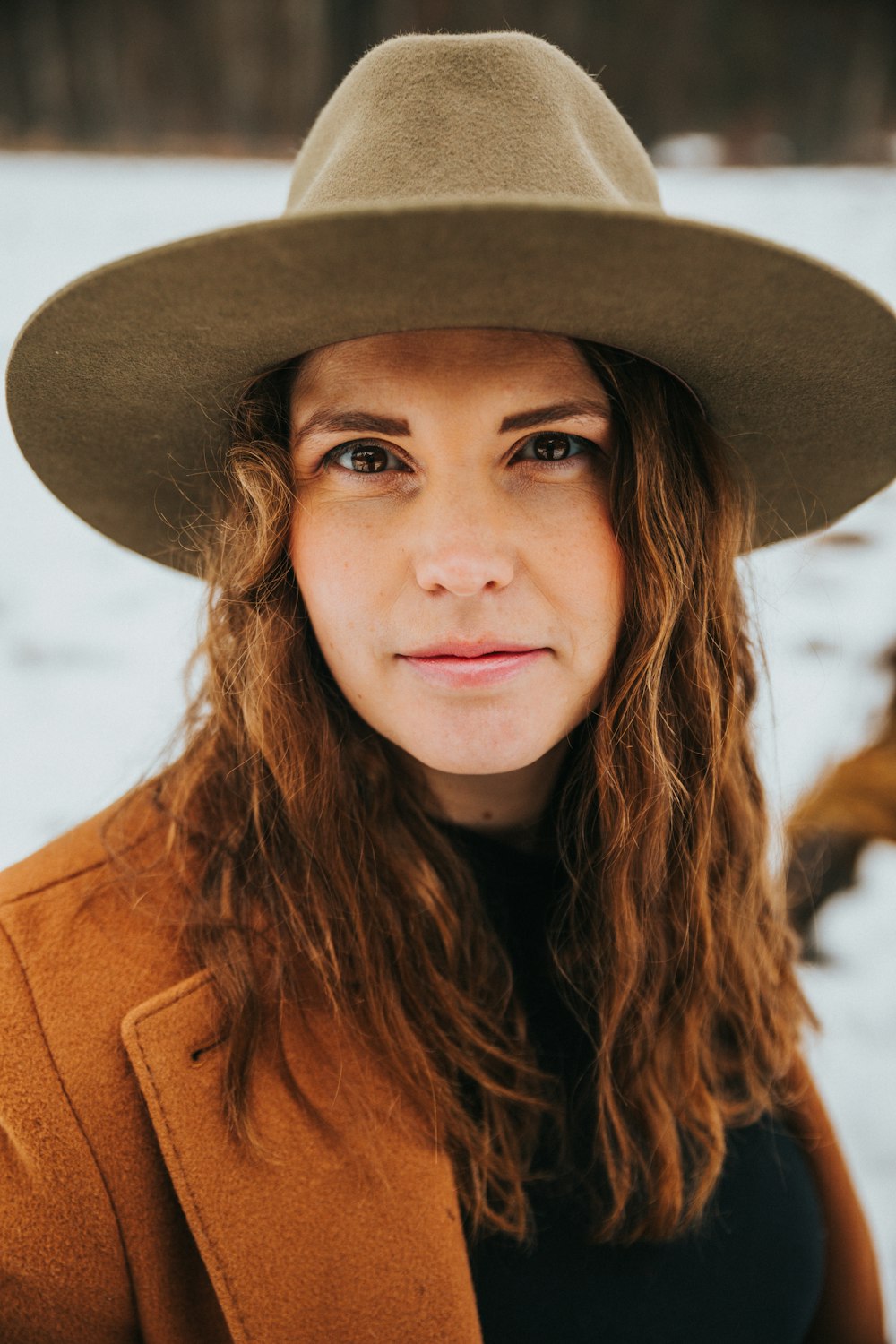 woman wearing brown hat