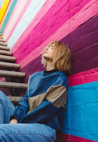 woman leaning on wall