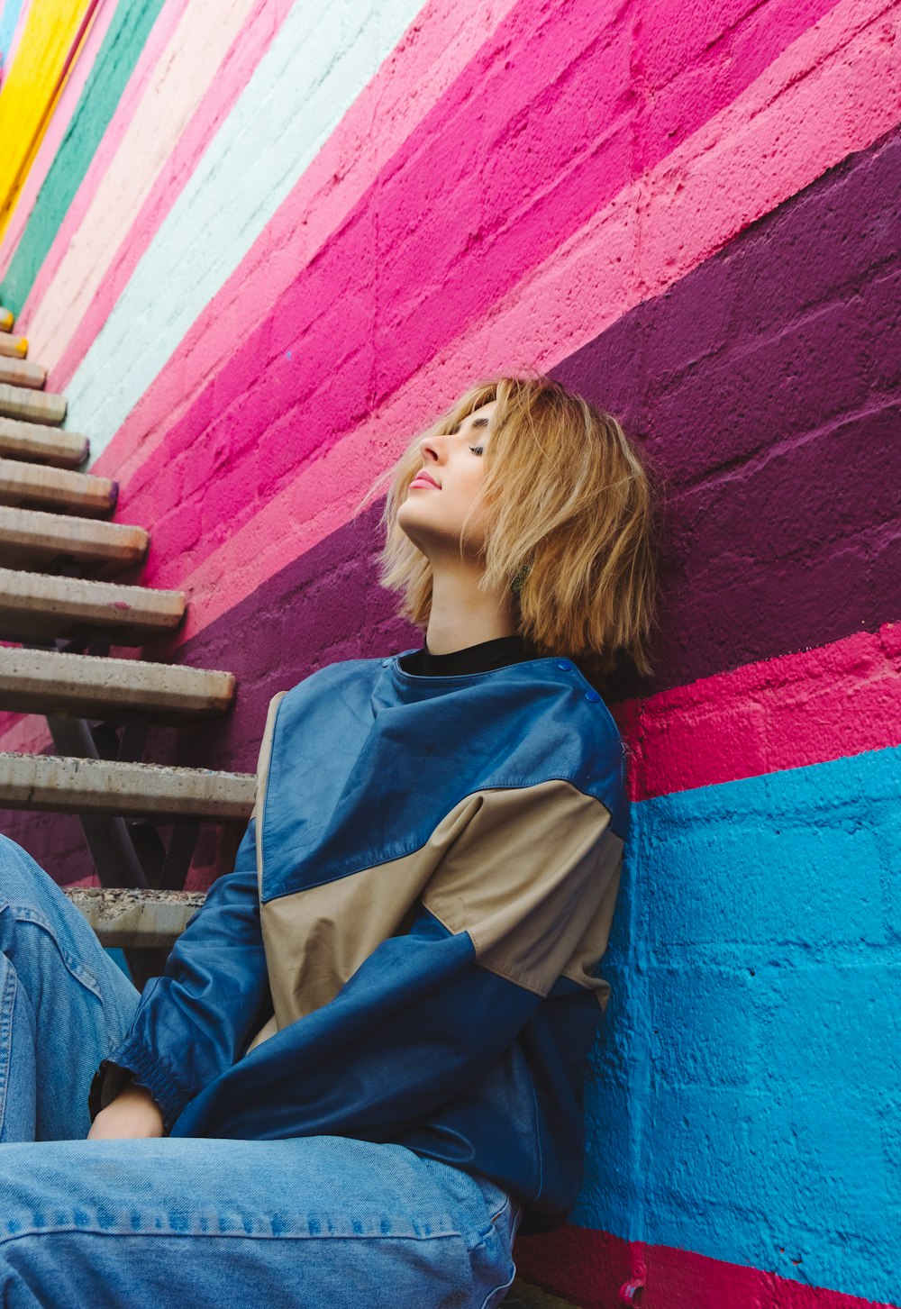 woman leaning on wall