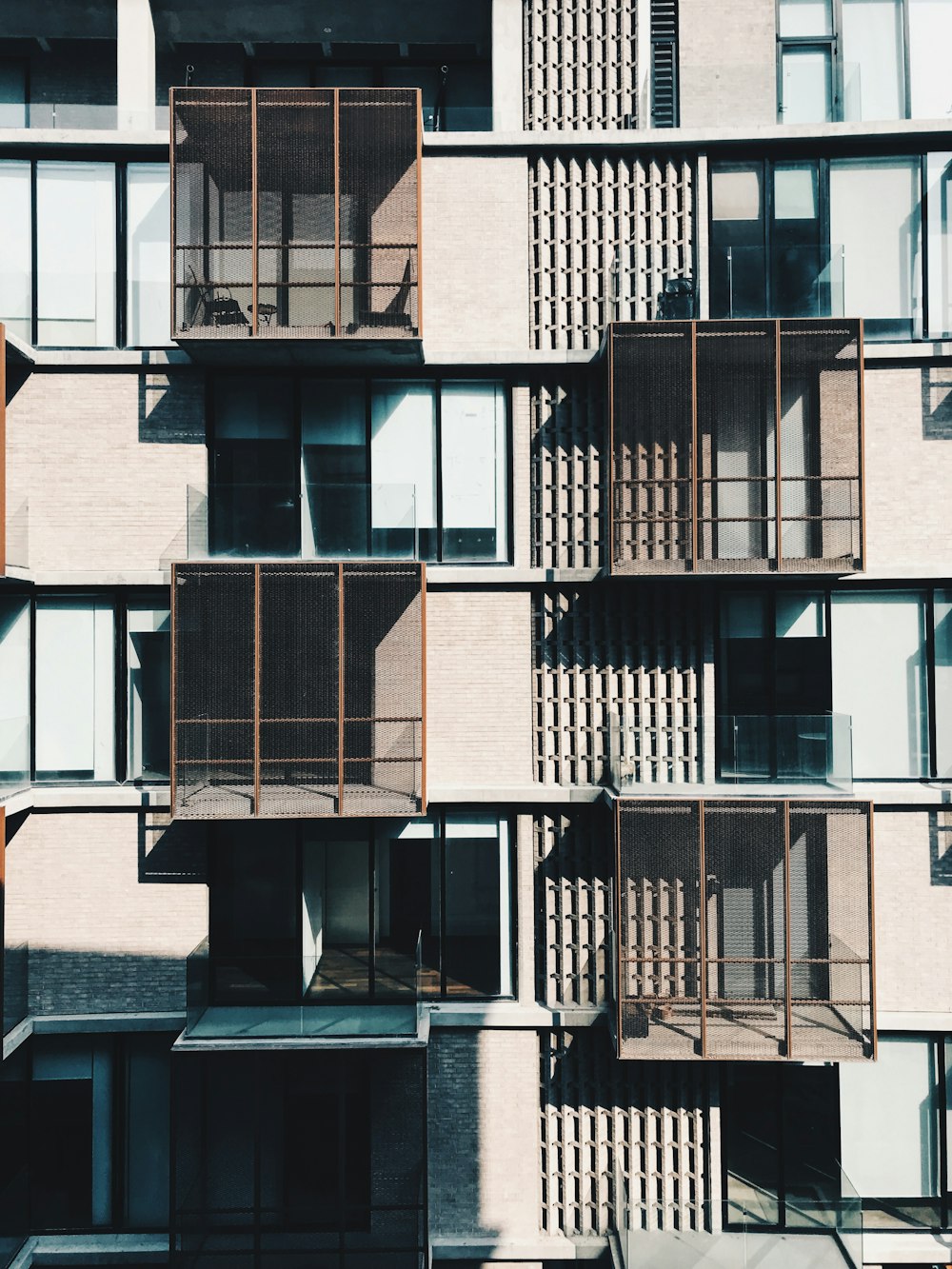 a very tall building with lots of balconies