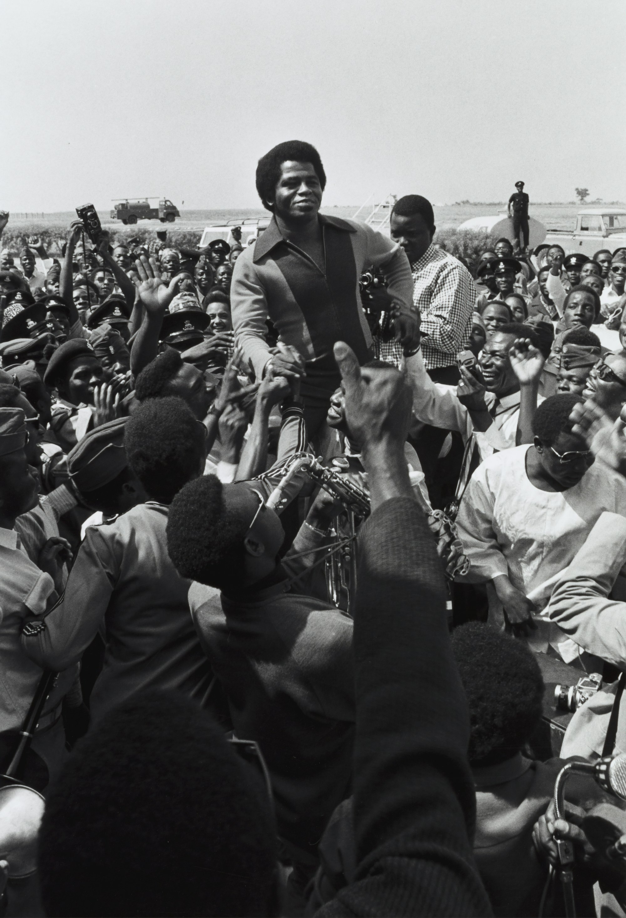 Singer James Brown being greeted by fans upon his arrival at Kaduna Airport, 1970