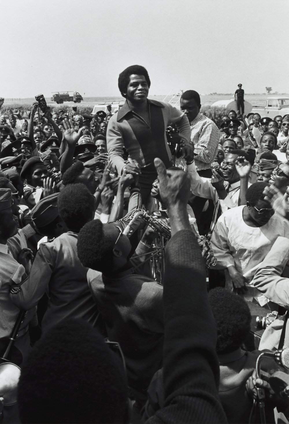 a large group of people sitting around each other