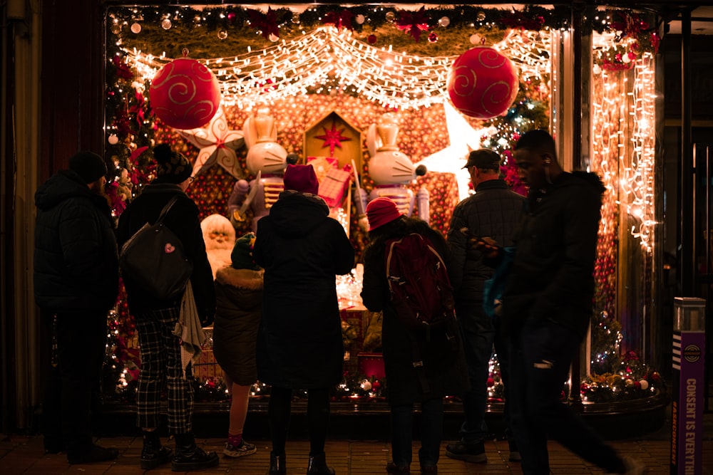 people standing and looking Christmas decors