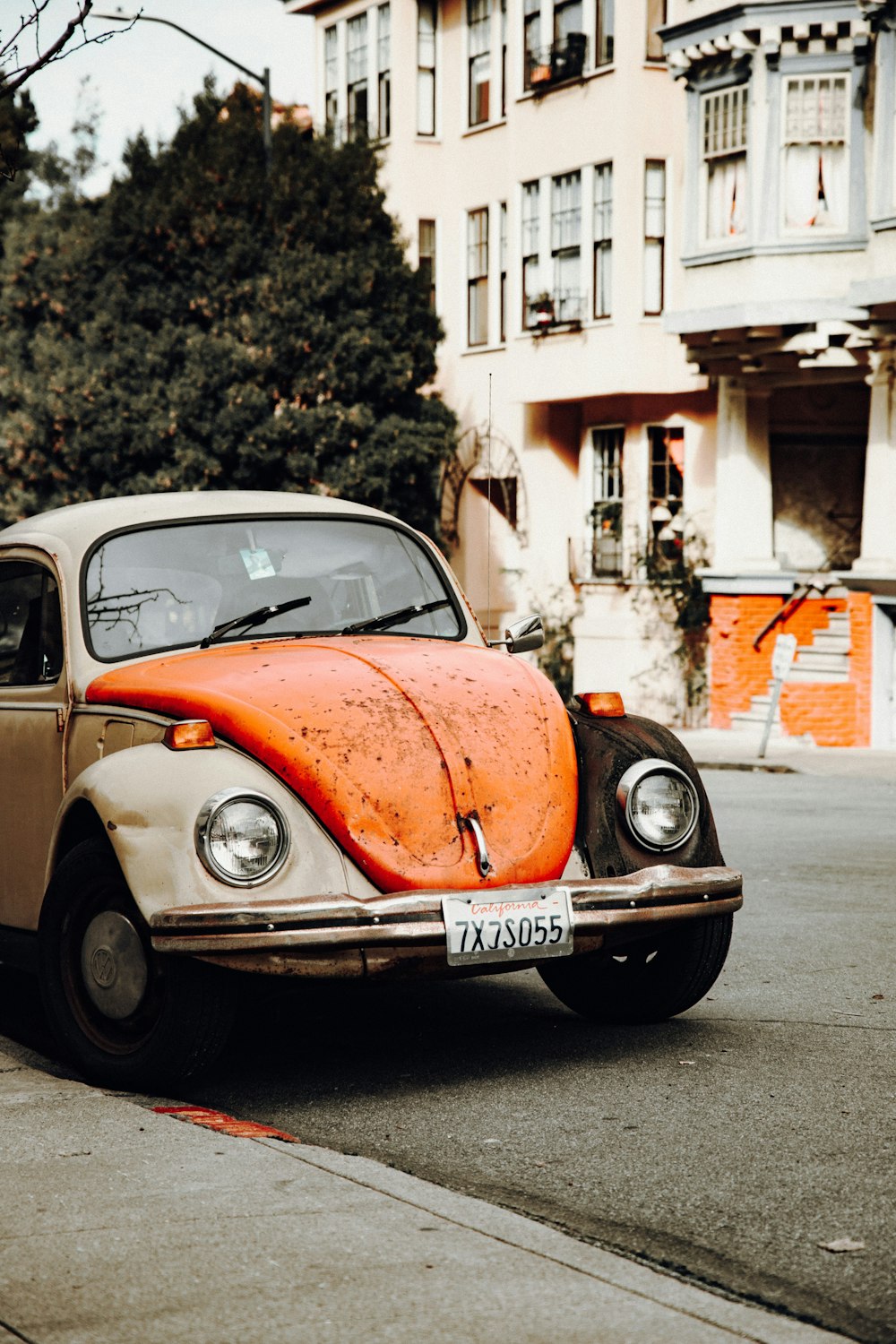 gray and orange Volkswagen Beetle
