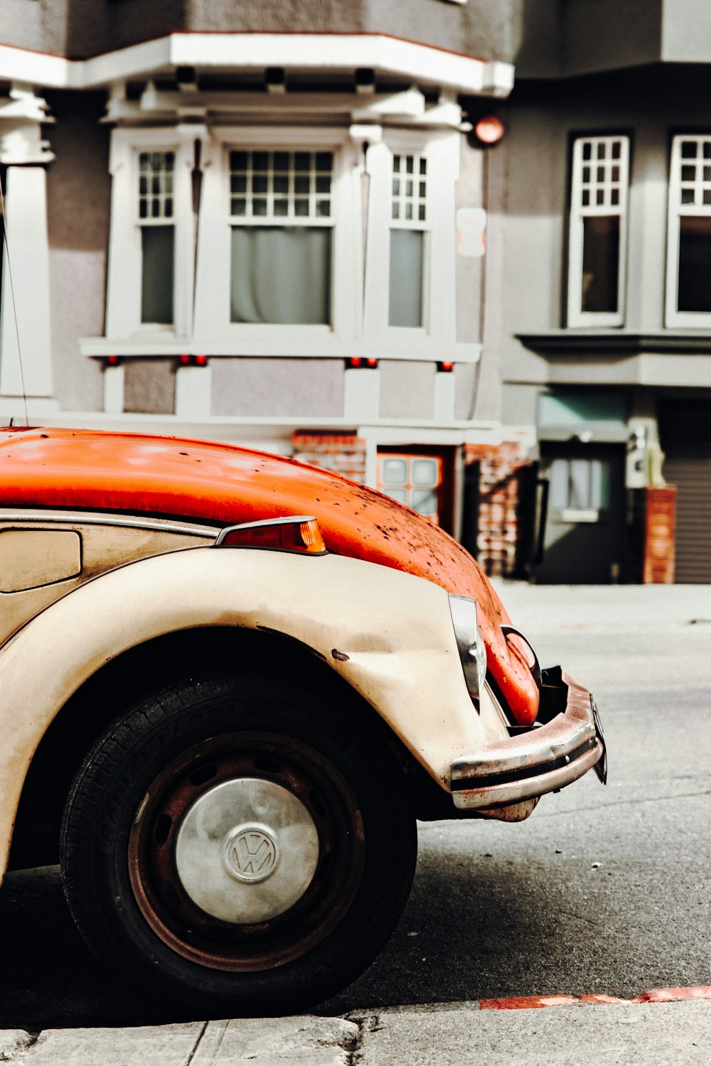 gray and orange Volkswagen Beetle