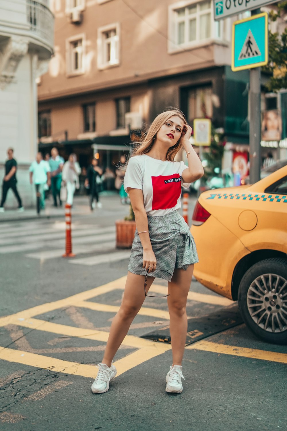 woman standing beside a cab