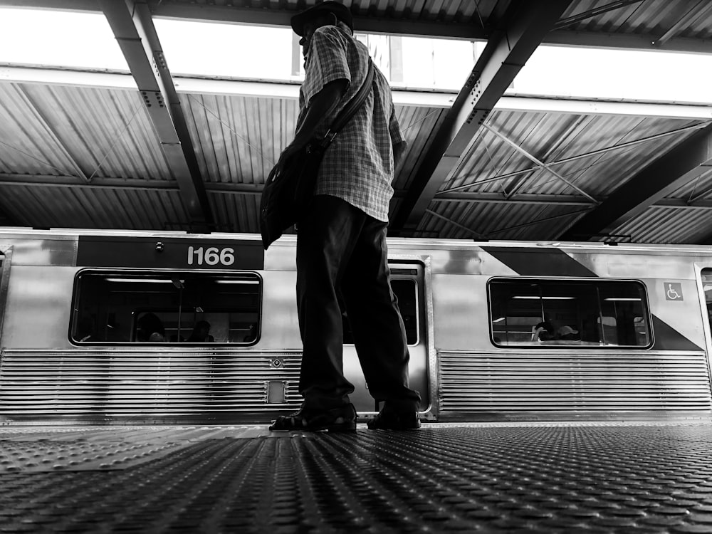 man standing on the train station