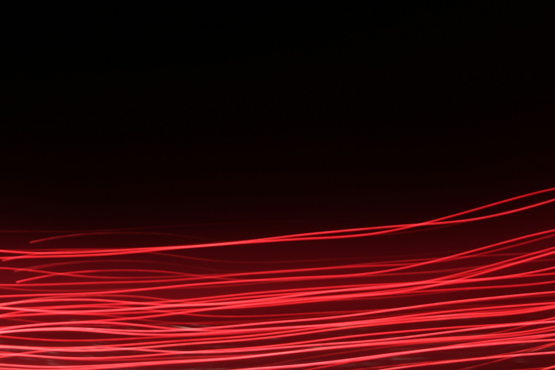 a blurry photo of red lights in the dark