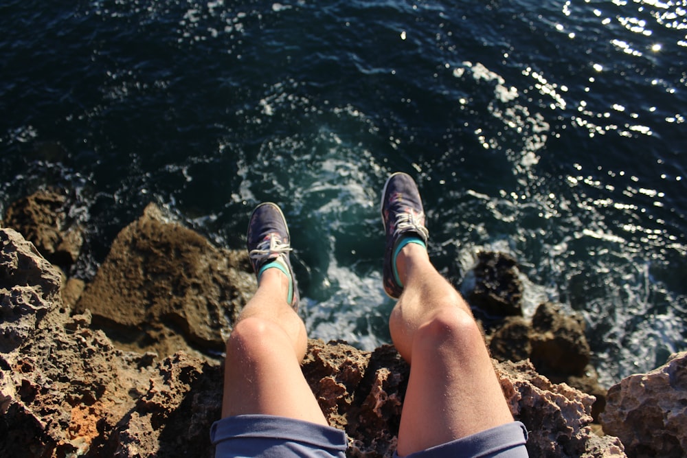 person wearing grey running shoes