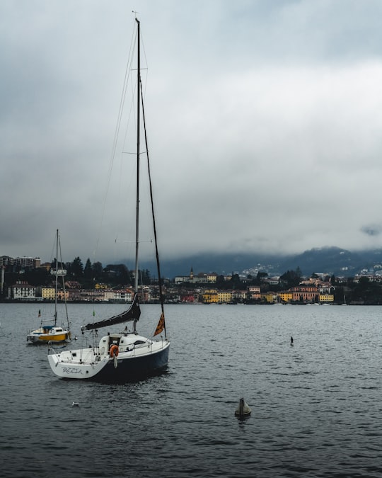 white and black yacht on the body of water in Lake Como Italy