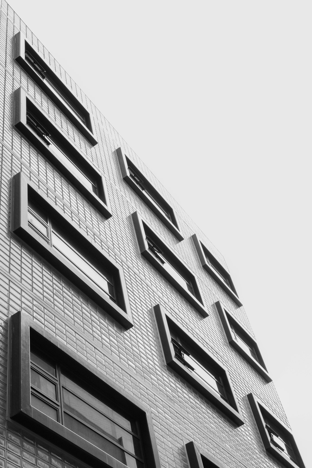 grayscale photo of building windows