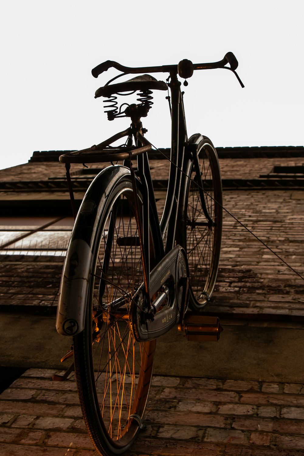 brown commuter bike on wall
