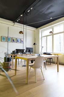 empty brown chair beside table with lamp