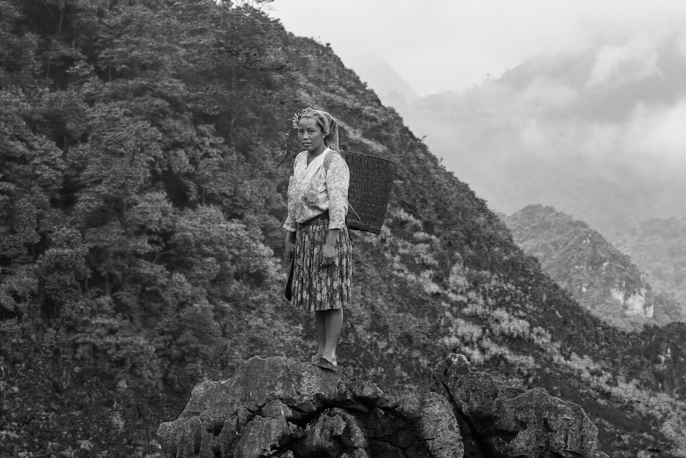 woman standing on rock