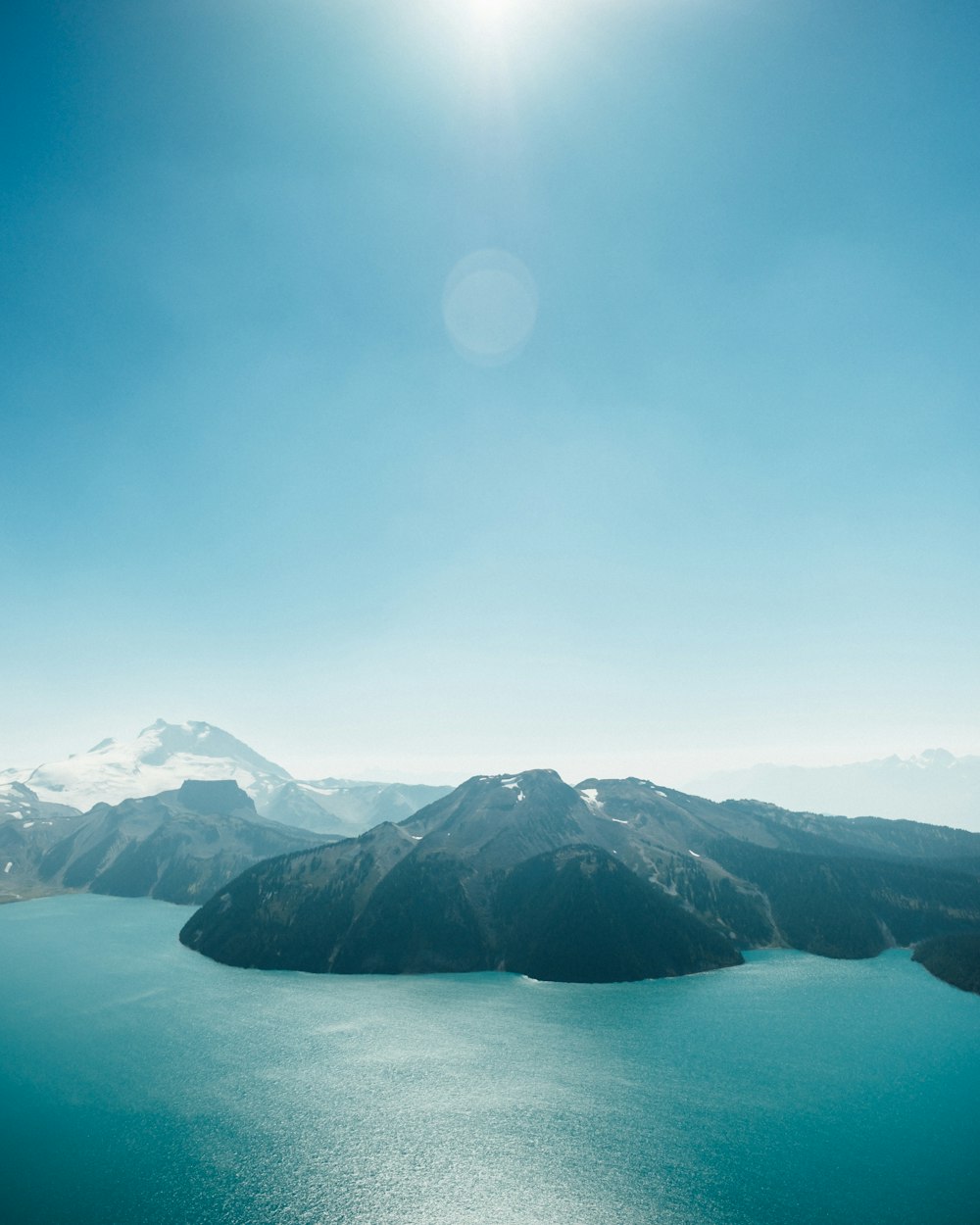 body of water with mountains