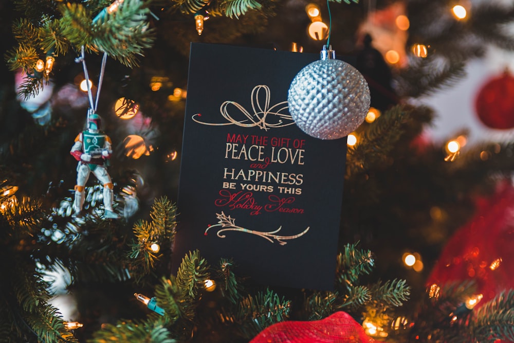 selective focus photography of hanged ornaments on Christmas tree