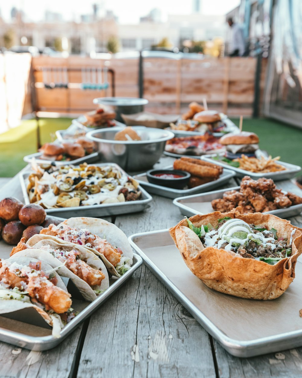 selective focus photography of plates of food on table during daytime