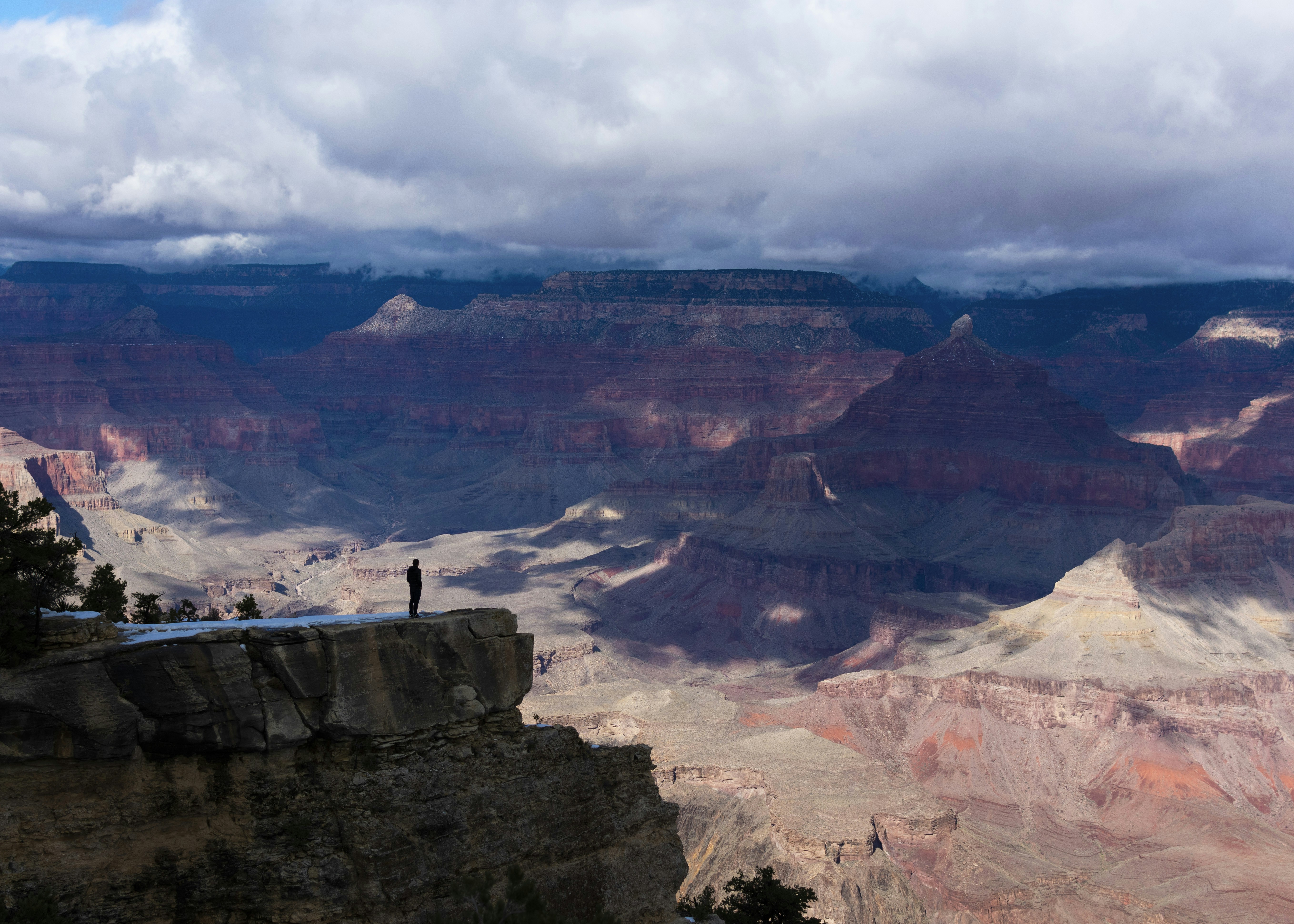 man standing on cliff