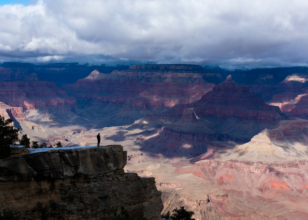 man standing on cliff