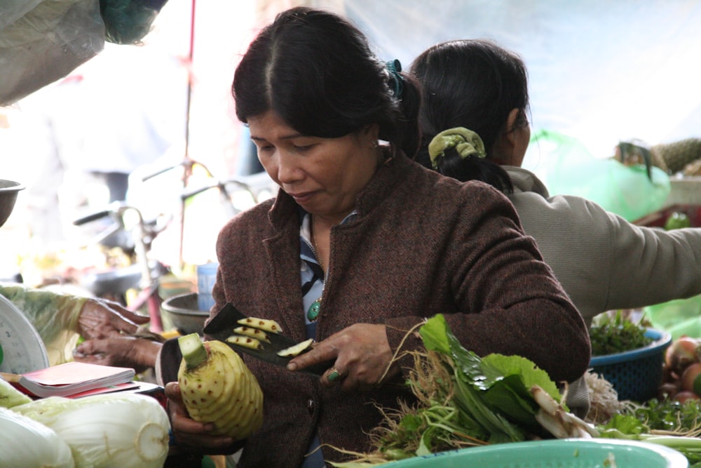 woman holding vegetable