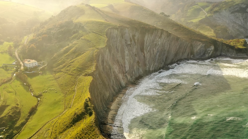aerial view green and brown cliff during daytime