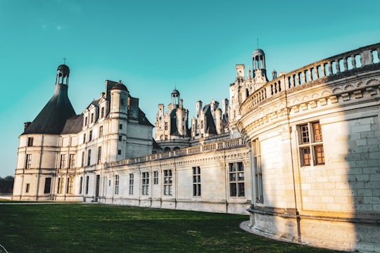 gray concrete castle during daytime in Château de Chambord France