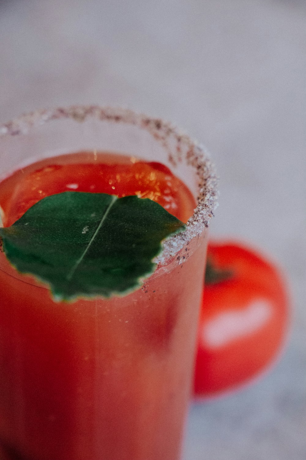 clear drinking glass with tomato juice