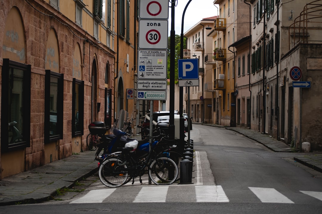 bicycles parked beside pedestrian lane