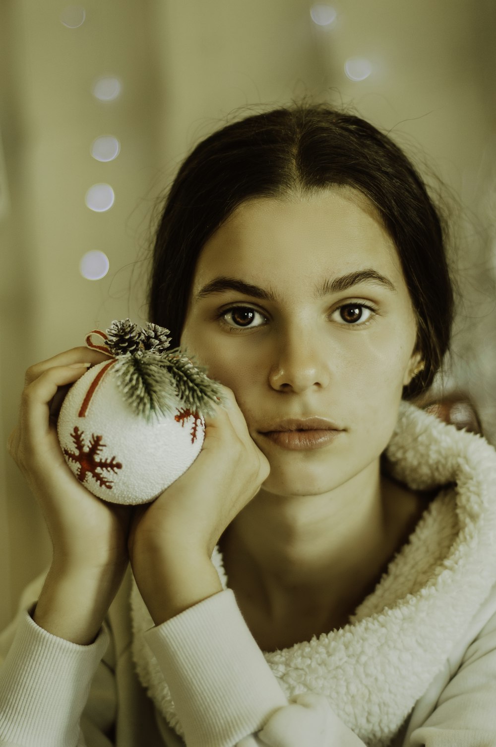 woman holding a bauble ornament