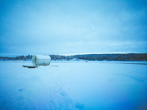 Modern data center in Finland surrounded by snowy landscape.