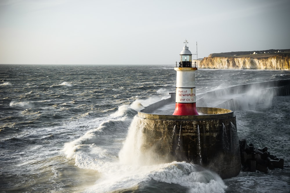 lighthouse and a splashing body of water